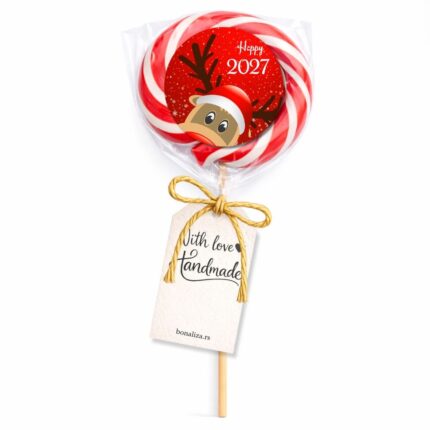 Crvena i zelena lizalica sa irvasom kao praznična dekoracija